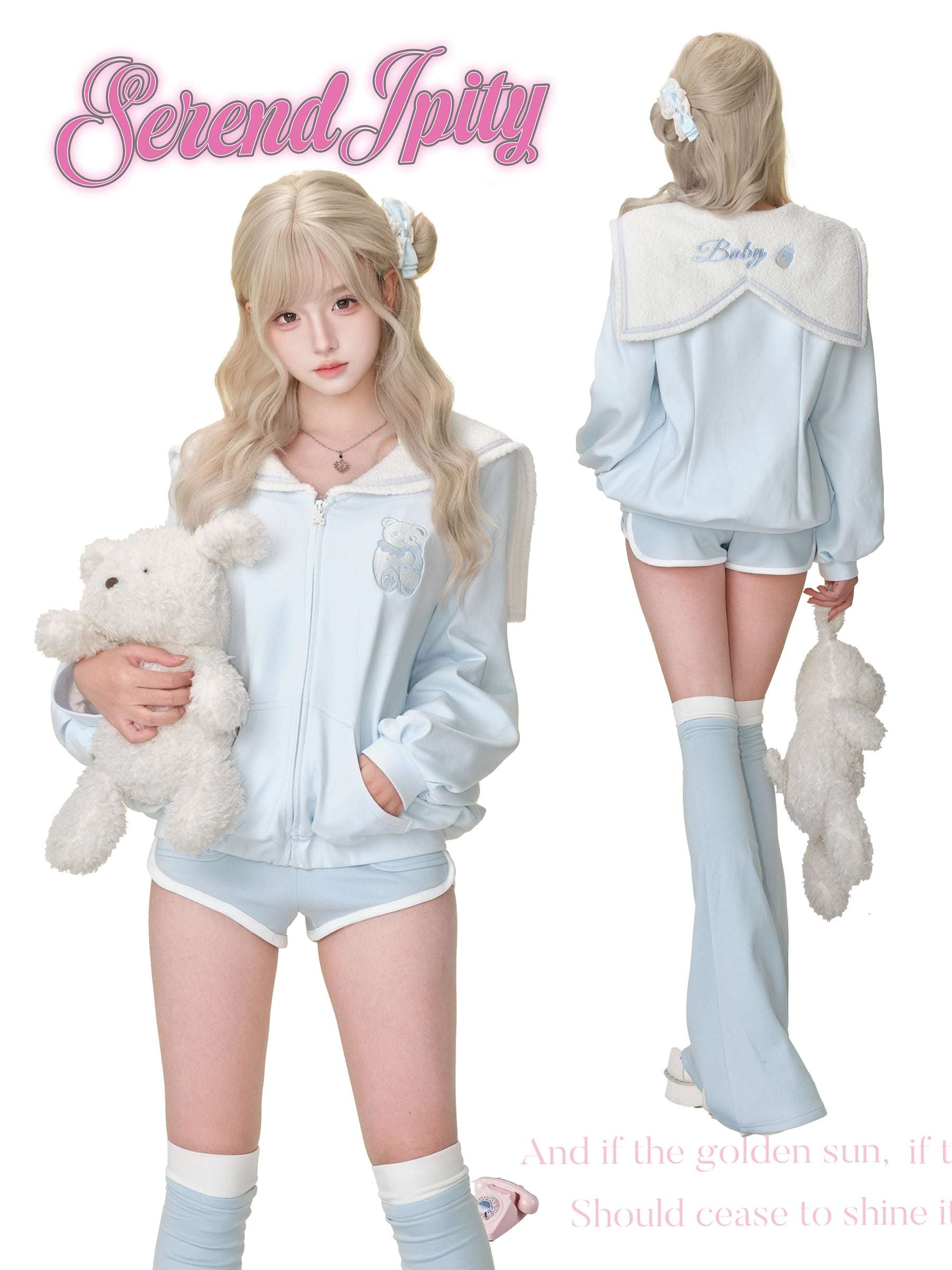 Person wearing a light blue tracksuit with a teddy bear, holding a plush toy.