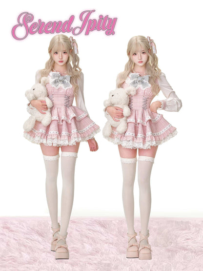 Two identical dolls in a pink outfit with white teddy bears on a white background