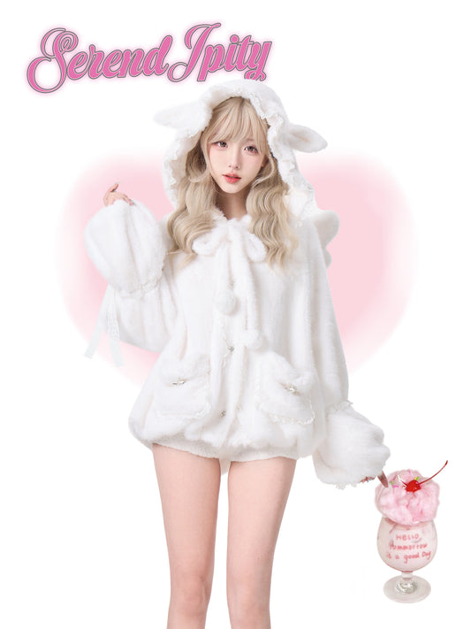 Person wearing a white fluffy outfit with bunny ears, holding a pink dessert, on a light pink background