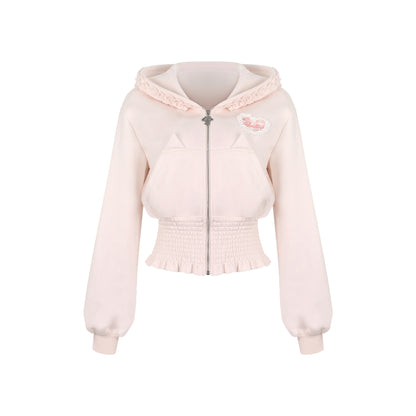 Light pink hoodie with lace details on a white background
