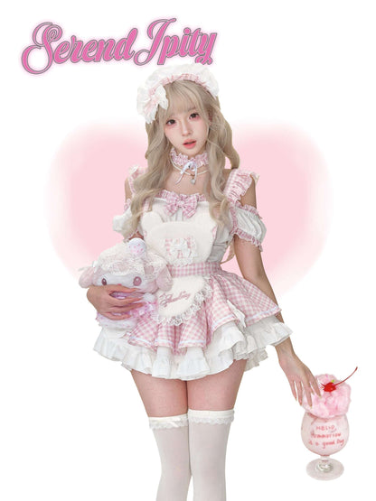 Person in a pink and white outfit on a white background