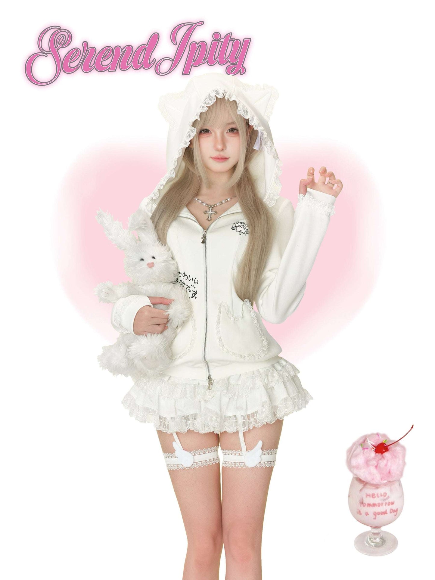 Person wearing a white outfit with a hood and ruffled details, holding a plush toy