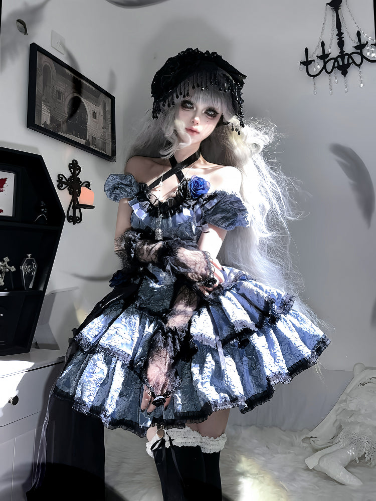 Person wearing a gothic-style dress with blue flowers in a room.