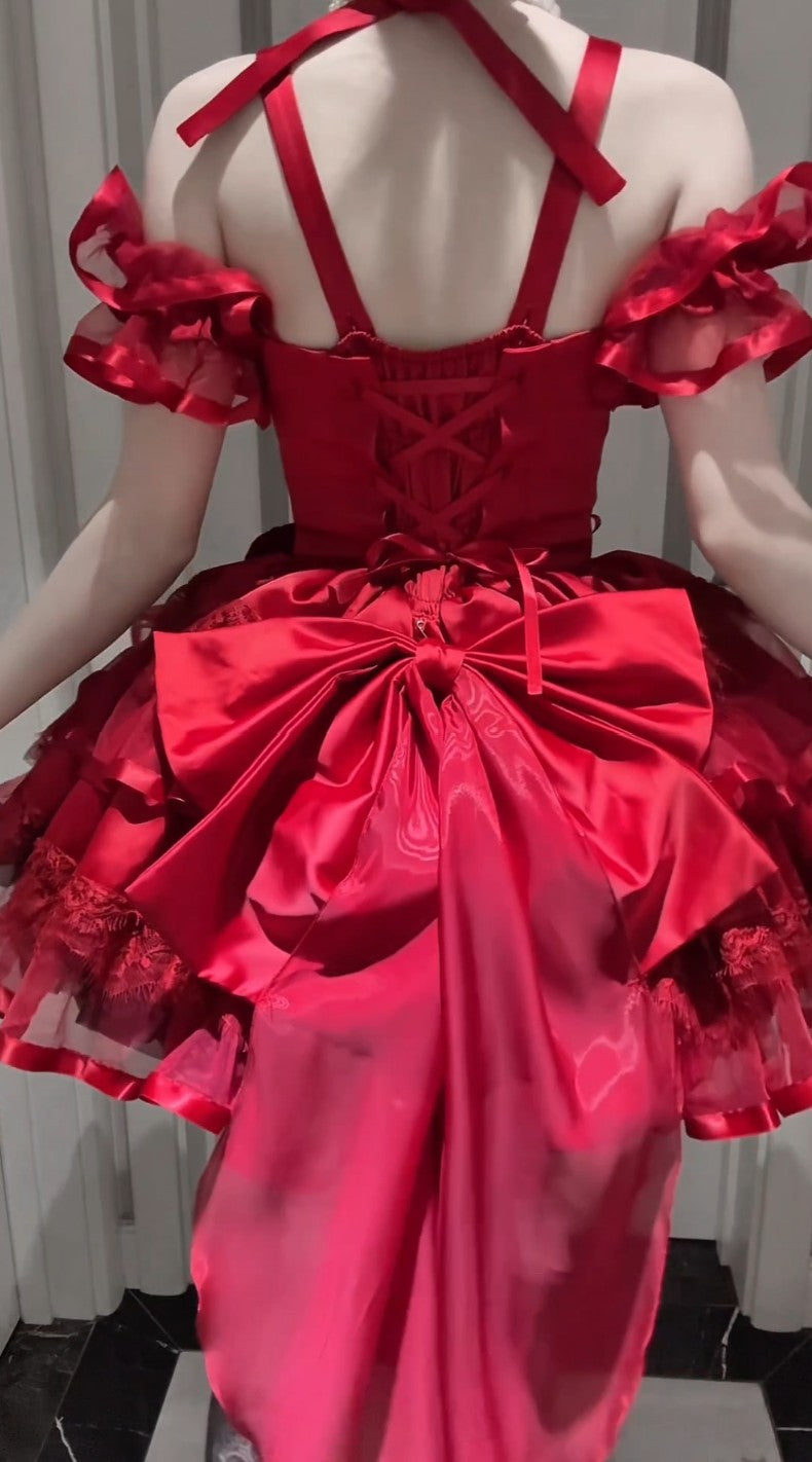 Red dress with intricate detailing on a mannequin against a neutral background