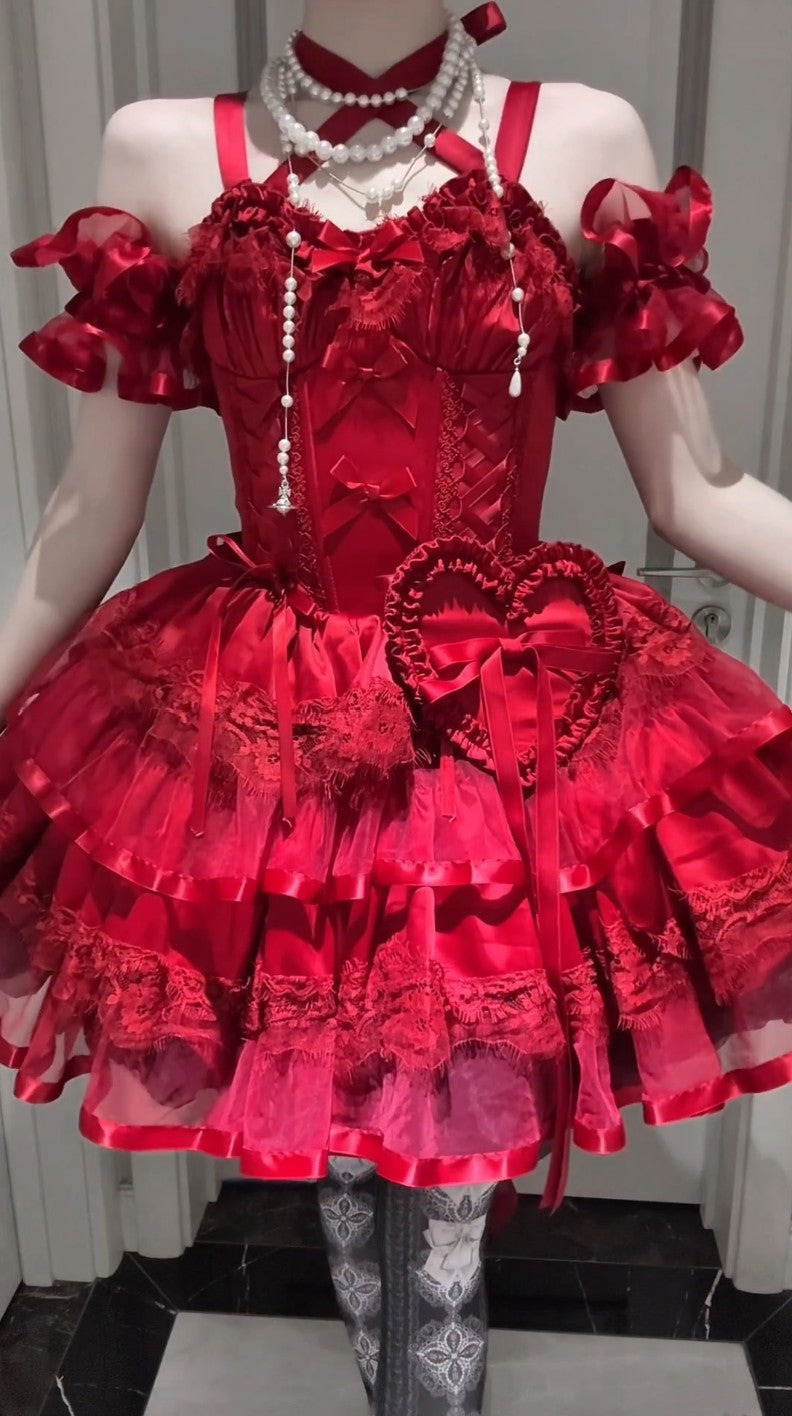 Red lace dress on a mannequin with a white background