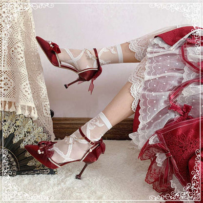 Red high-heeled shoes with a matching dress on a white background