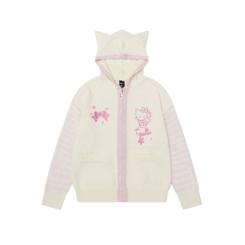 Women's cream hoodie with pink accents and embroidered designs on a white background