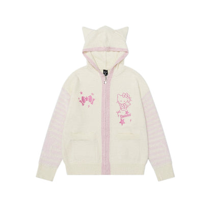 Women's cream hoodie with pink accents and embroidered designs on a white background