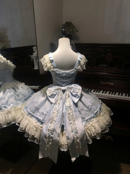 Mannequin wearing a detailed dress with ruffles and lace in front of a piano.