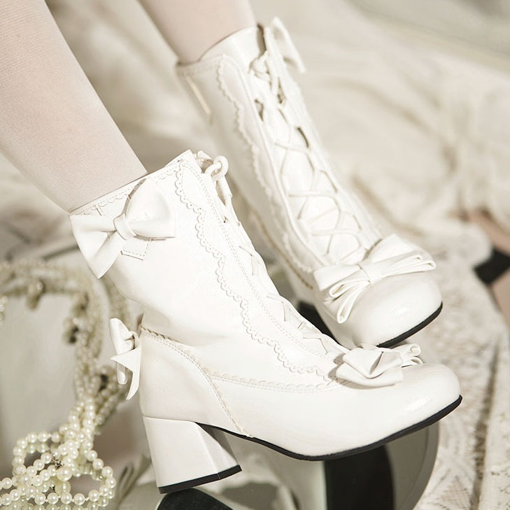 White lace-up boots with bows on a blurred background