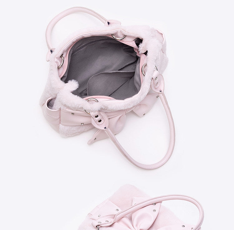 Pink pet carrier with fluffy interior on a white background