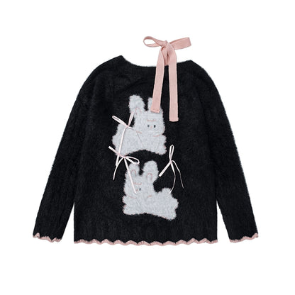 Black sweater with white rabbit design and pink ribbons on a white background