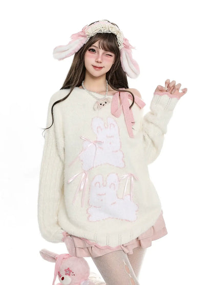 Person wearing a cute outfit with bunny ears and a white sweater on a white background