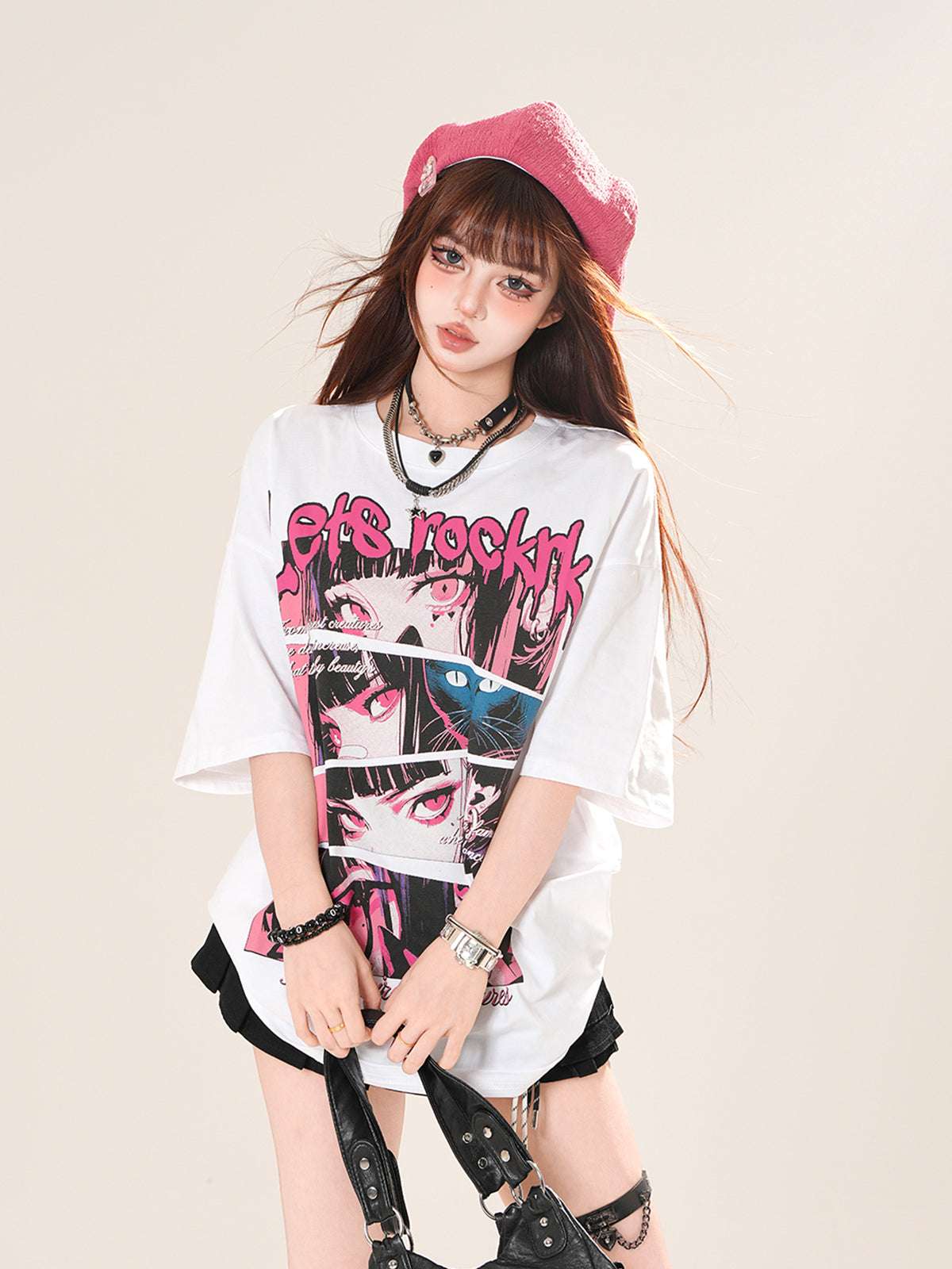 Person wearing a white t-shirt with graphic design and text, standing against a plain background