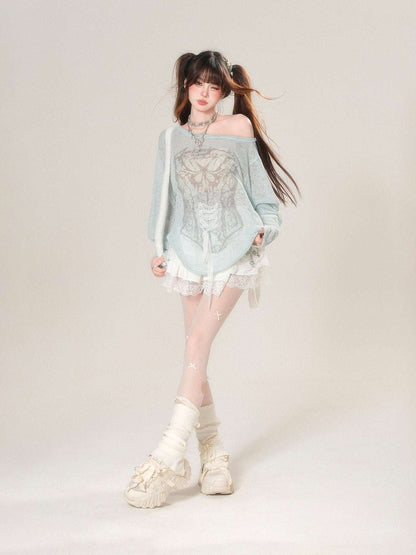 Person wearing a light blue off-shoulder top with lace details on a plain background