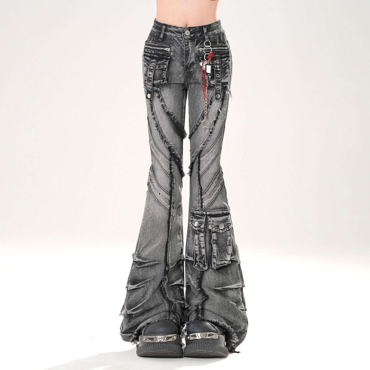 Distressed black jeans on a white background