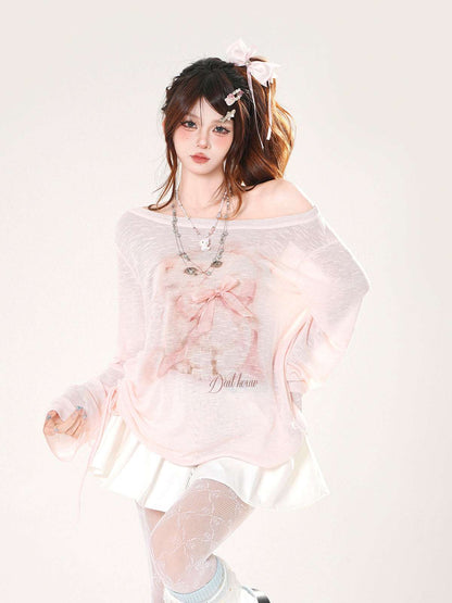 Person wearing a light pink off-shoulder top with floral details on a white background