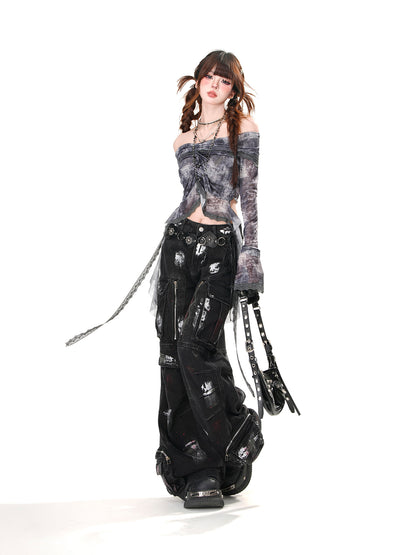 Person wearing a unique outfit with a strapless top, black pants, and long gloves on a white background