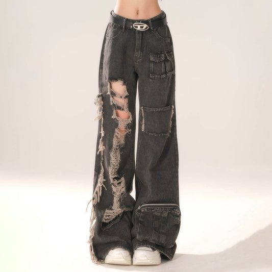 Distressed black jeans with a belt on a white background